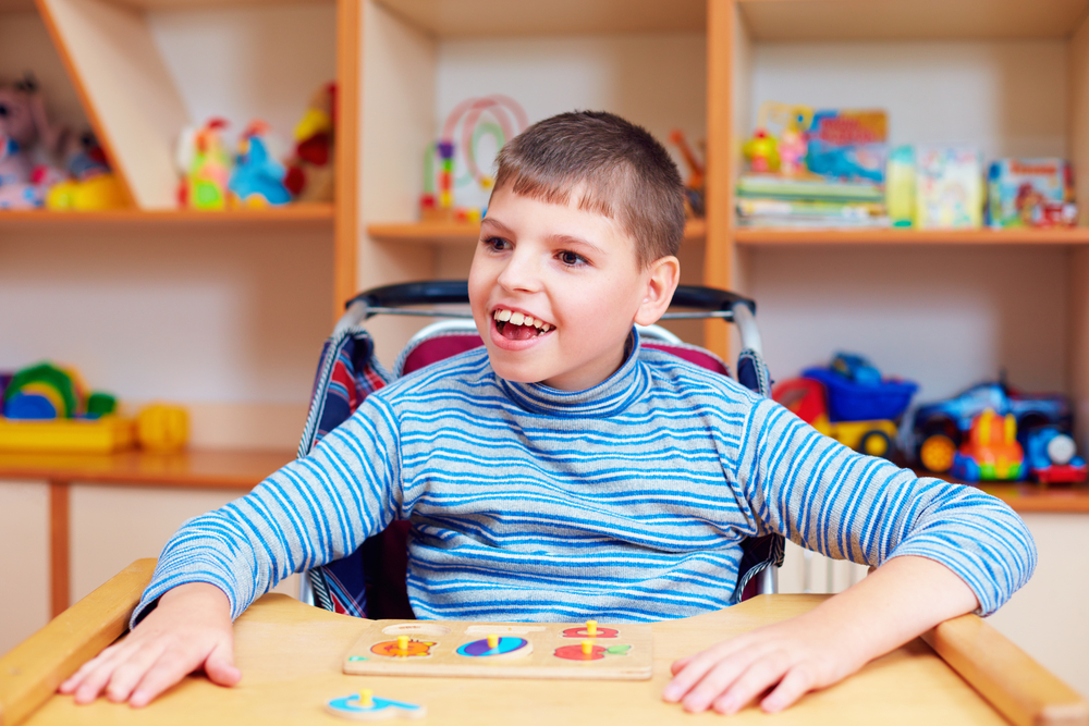 Screen for Success young boy in wheelchair